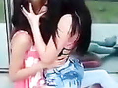 Two stunning lesbians make out with each other in public