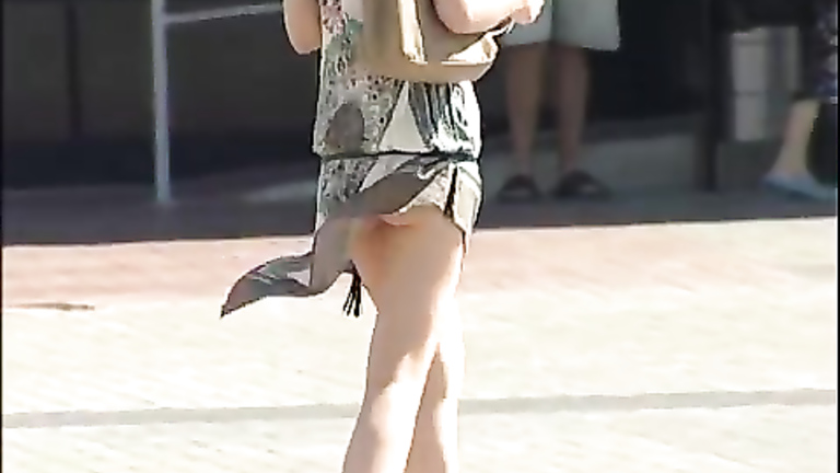 Slim blonde lady has her small butt revealed in public