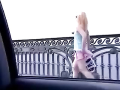 Sexy blonde has her short skirt lifted up by a strong wind