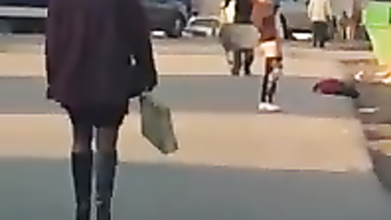 Crazy maid exposes her ass in the middle of the street