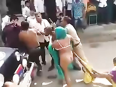 Street fight with a naked female ass