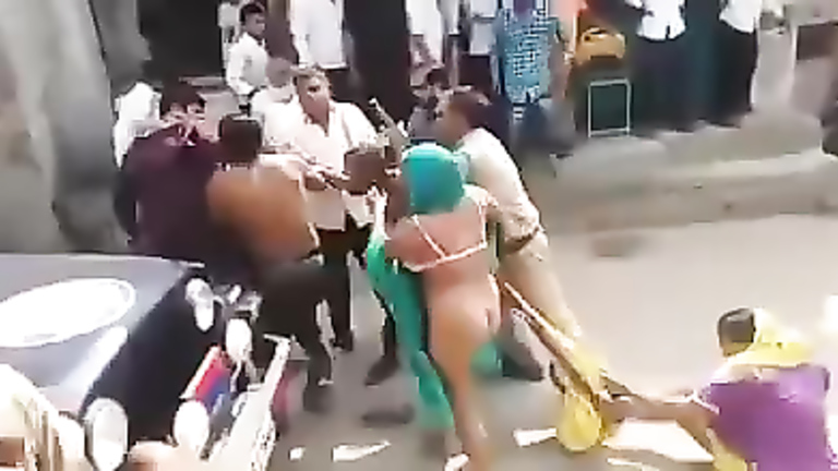 Street fight with a naked female ass