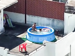 My horny neighbors caught having sex in the pool