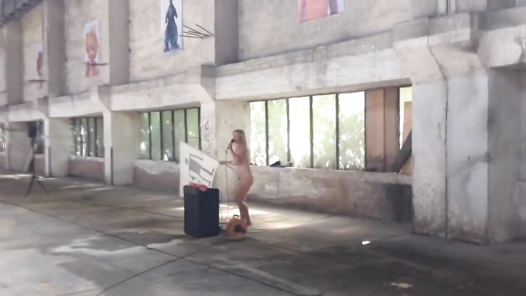 Hot and voluptuous blonde runs around the building naked