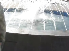 Hottest coed girl takes a bath in a fountain