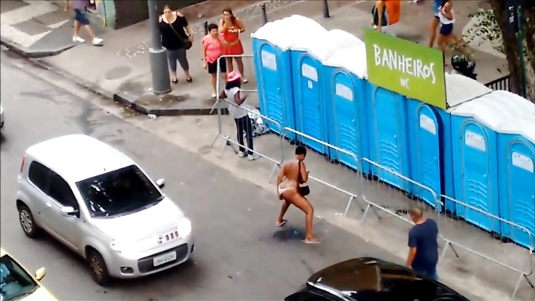 Shameless woman pisses on the central road of Sao Paulo