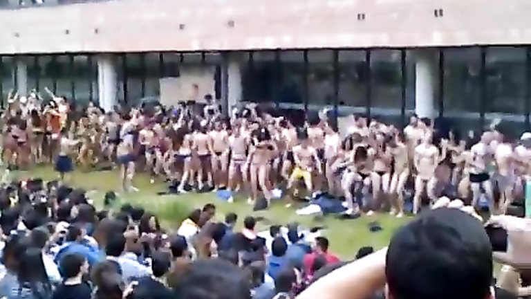 Naked students dancing to the music