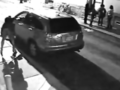 NYC prostitute hides behind a big car to relieve her bladder