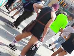 Punk girl pisses hard on the middle of the sidewalk