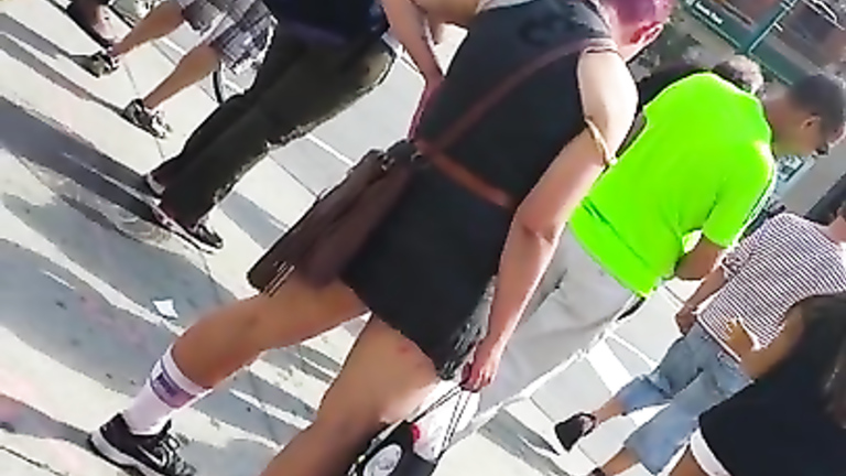 Punk girl pisses hard on the middle of the sidewalk