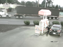 Desperate traveler soaks the road asphalt at the gas station