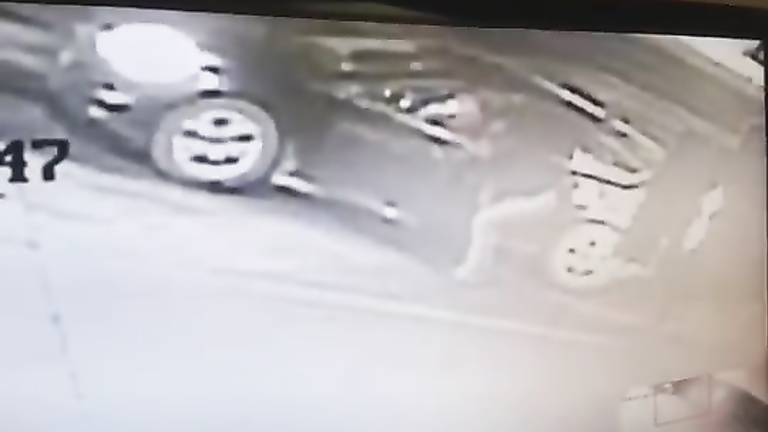 Desperate damsel urinates next to her car