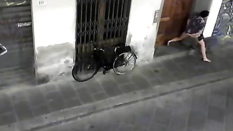 Desperate prostitute pisses in front of someone's doors