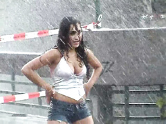 Stunning Latina babe has fun dancing in the rain