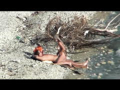Lazy guy cums into a girlfriend's pussy on the nudist beach