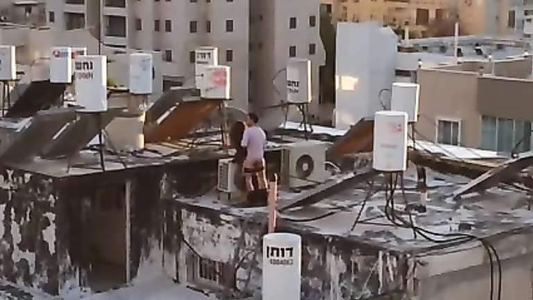 Turkish couple copulates on the top of their building