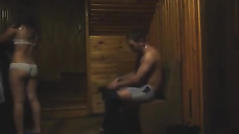 Ravishing brunette chick gets seduced in the sauna