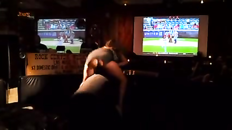 Stacked blonde bombshell rides a mechanical bull in the sport bar