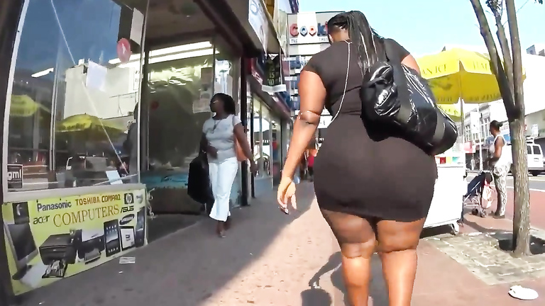 Ebony BBW with a huge booty walks down the street voyeurstyle photo