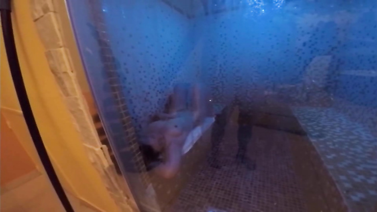 Angelic woman tans her body while being on a sauna bed completely naked