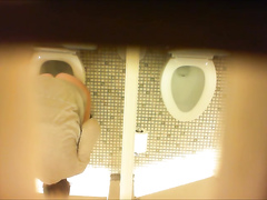 Desperate milf takes a long piss in the ladies room