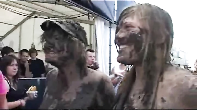 Chubby babes enjoy wrestling each other in the mud