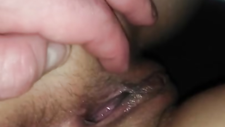 Fingers gently stimulate a dripping wet pussy