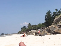 Man jerks off his little cock on a sexy woman at the beach