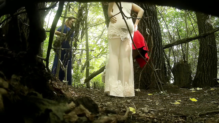 Classy bridesmaids take a piss together in the woods