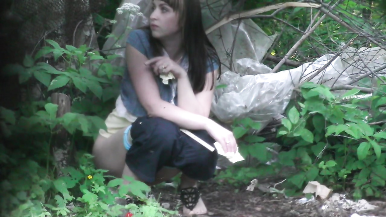Desperate brunette gets recorded relieving herself in the woods