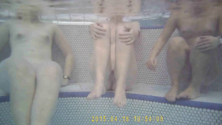 Three fillies enjoy the warm water in the sauna pool voyeurstyle
