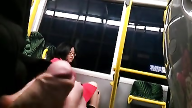 Asian lady innocently checks out a flasher masturbating in the bus