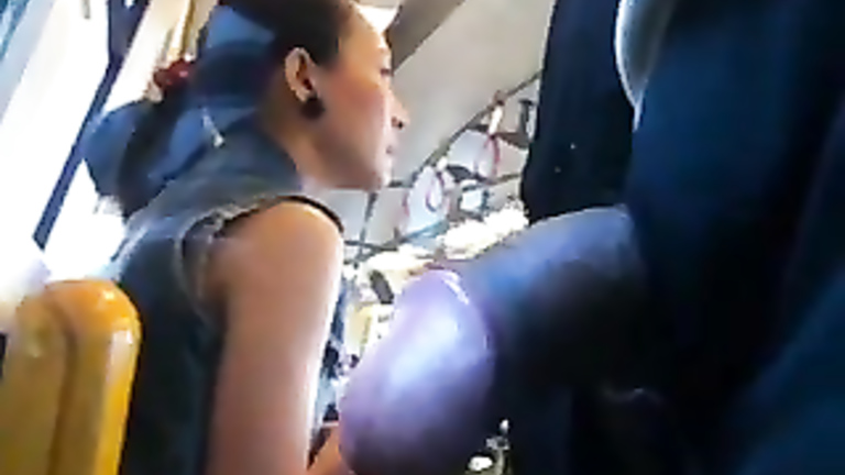 Dude wanks off on a stunning Asian lady while riding a bus
