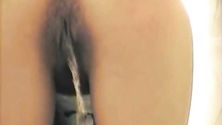 Hairy brunette pissing and captured on secret cam