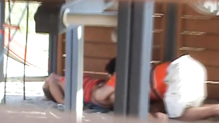 Adults copulating on the playground while filmed