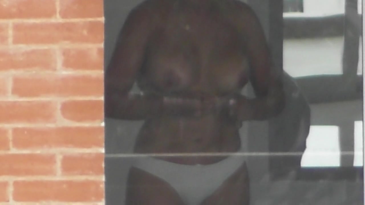 Busty woman filmed in secret while naked next to the window voyeurstyle image image