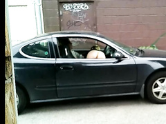 Naked hooker gives blowjob in the car and gets filmed