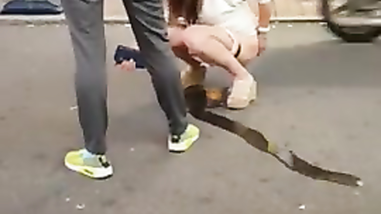 Korean girl pees on the street and gets taped