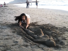 Sexy young brunette gets jizzed at the beach by stranger