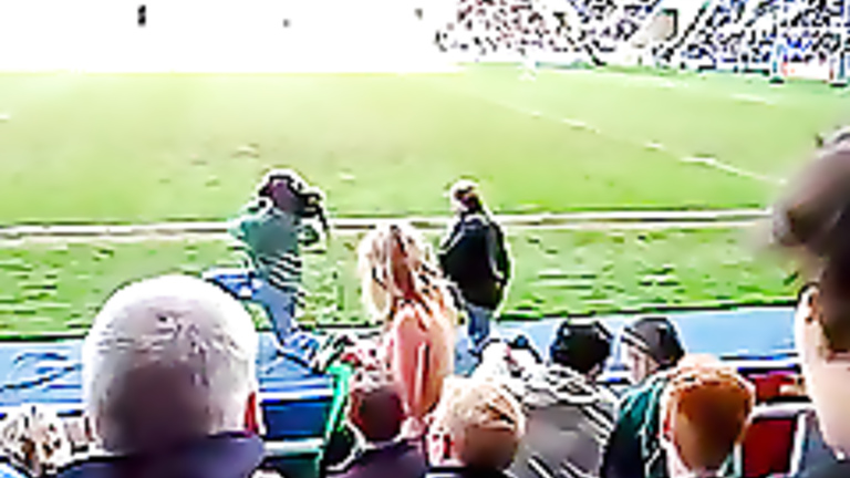 Female fan goes streaking at a football match