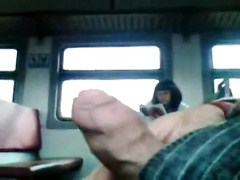 Jacking off uncut cock on the public train