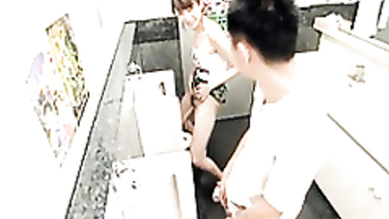 Sweet Japanese girl peeing at the urinal with her boyfriend
