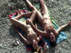 Sexy blowjob on the beach from his brunette girlfriend