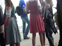 Oktoberfest beauties in line for the WC have to pee badly