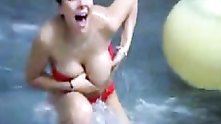 Busty girl flashing on the water slide