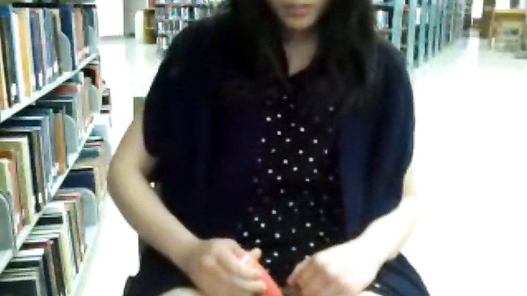 Asian nymph satisfies desires of her pussy in the library