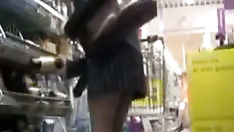 Girlfriend in stockings gives upskirt flash in the store