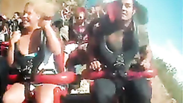 Roller coaster ride makes her big tits pop out. 