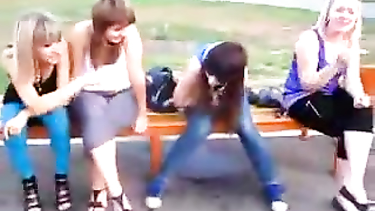 Naughty Russian girl pees through her jeans on public bench