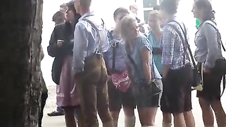 Oktoberfest girl in toilet line has to pee badly